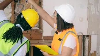 Maintenance technicians conducting on-site inspection and repair work for building systems