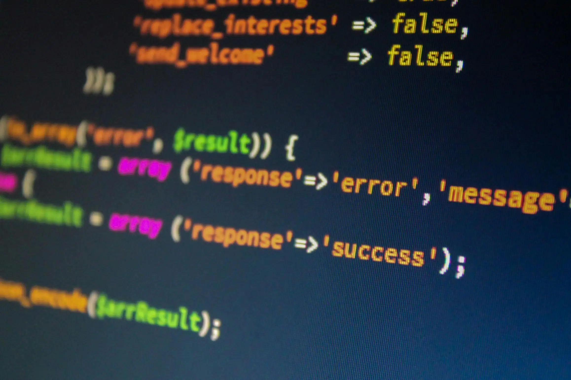 Shallow depth of field shot of clean data script lines on a screen showing a validated success status during a system data migration phase.