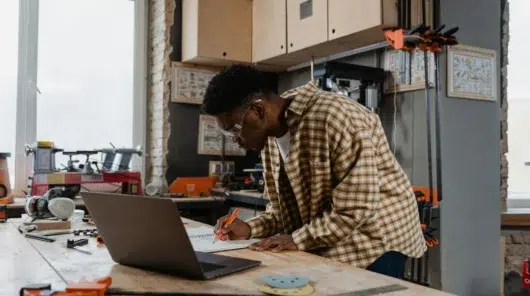 A maintenance engineer documenting work order history and technical specifications into a centralized CMMS to ensure standardized maintenance operations across APAC plants.