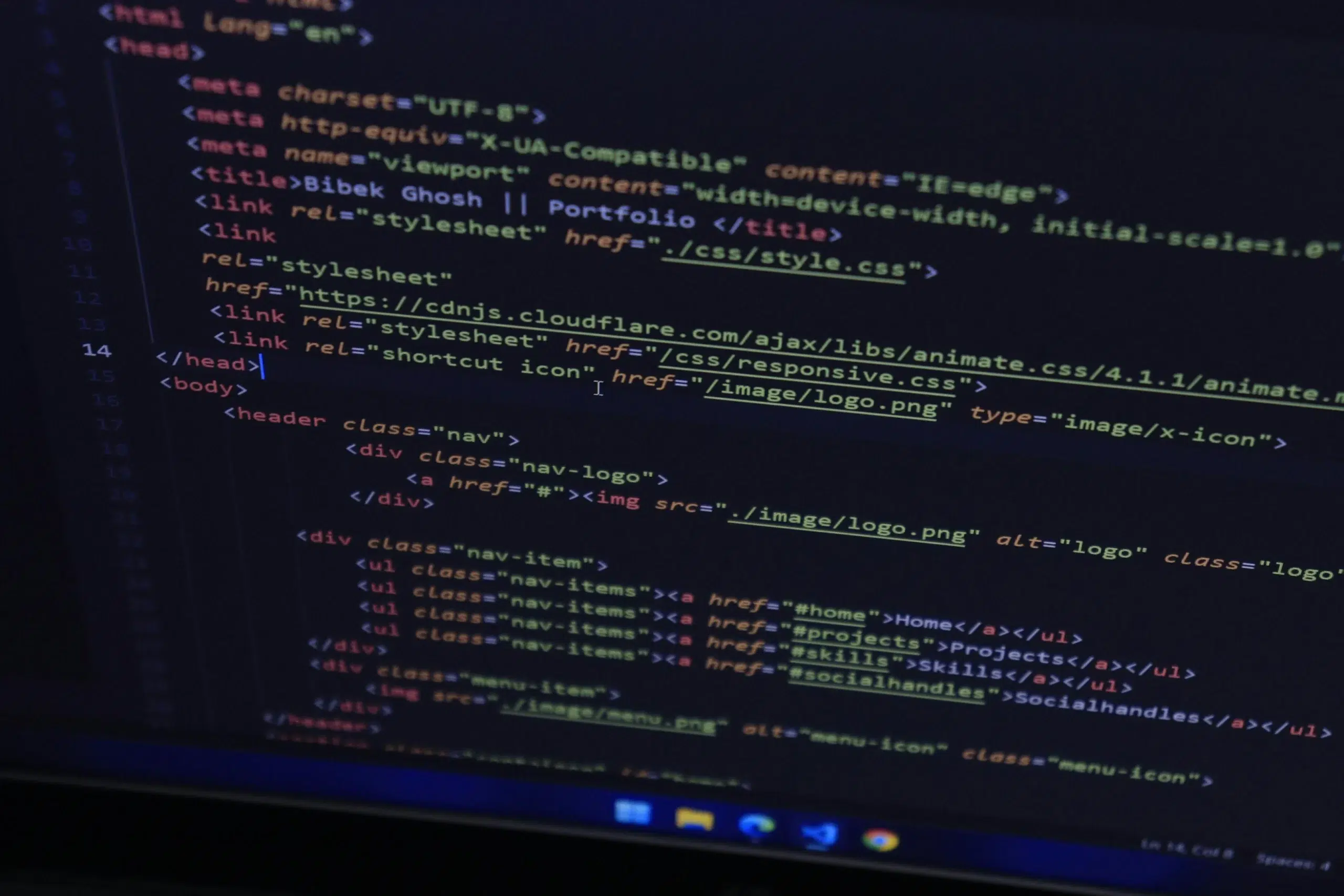 A close-up view of a computer monitor displaying dark-themed software code, illustrating backend system configuration for asset workflows.