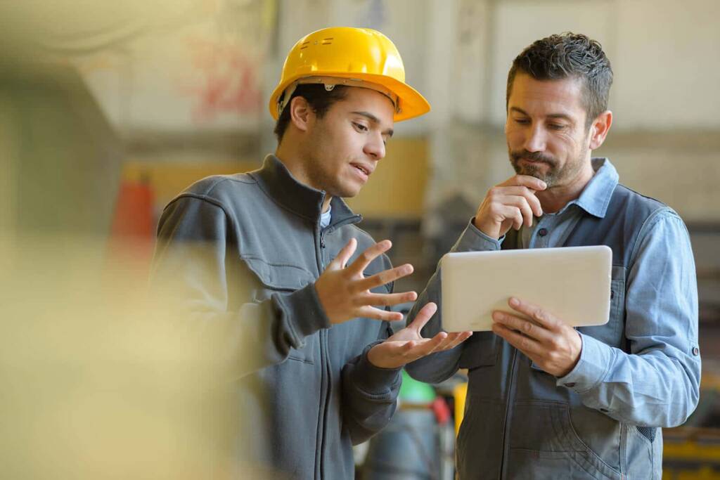 maintenance technicians with tablet